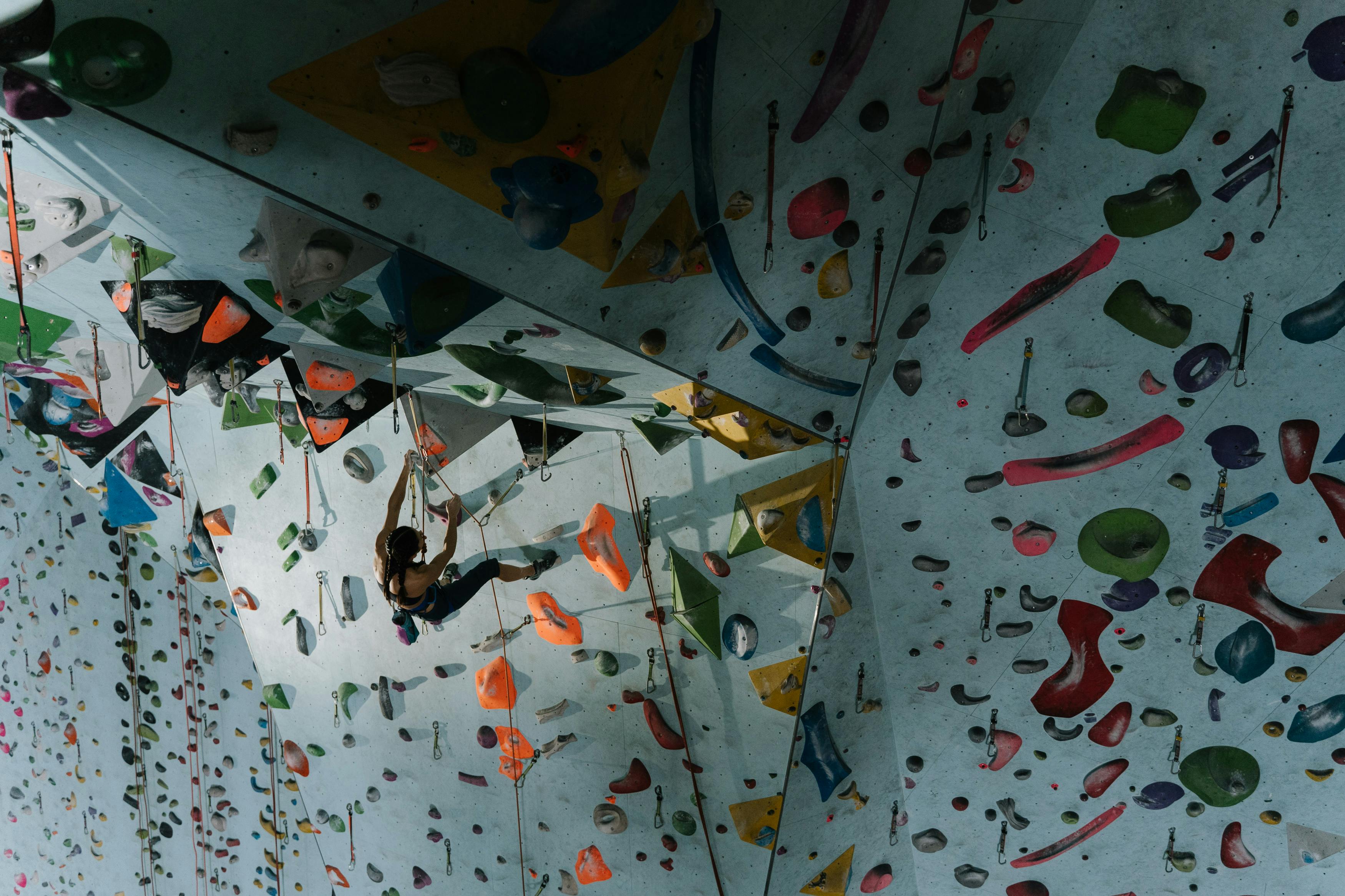Woman Climbing an Indoor Wall Climb · Free Stock Photo