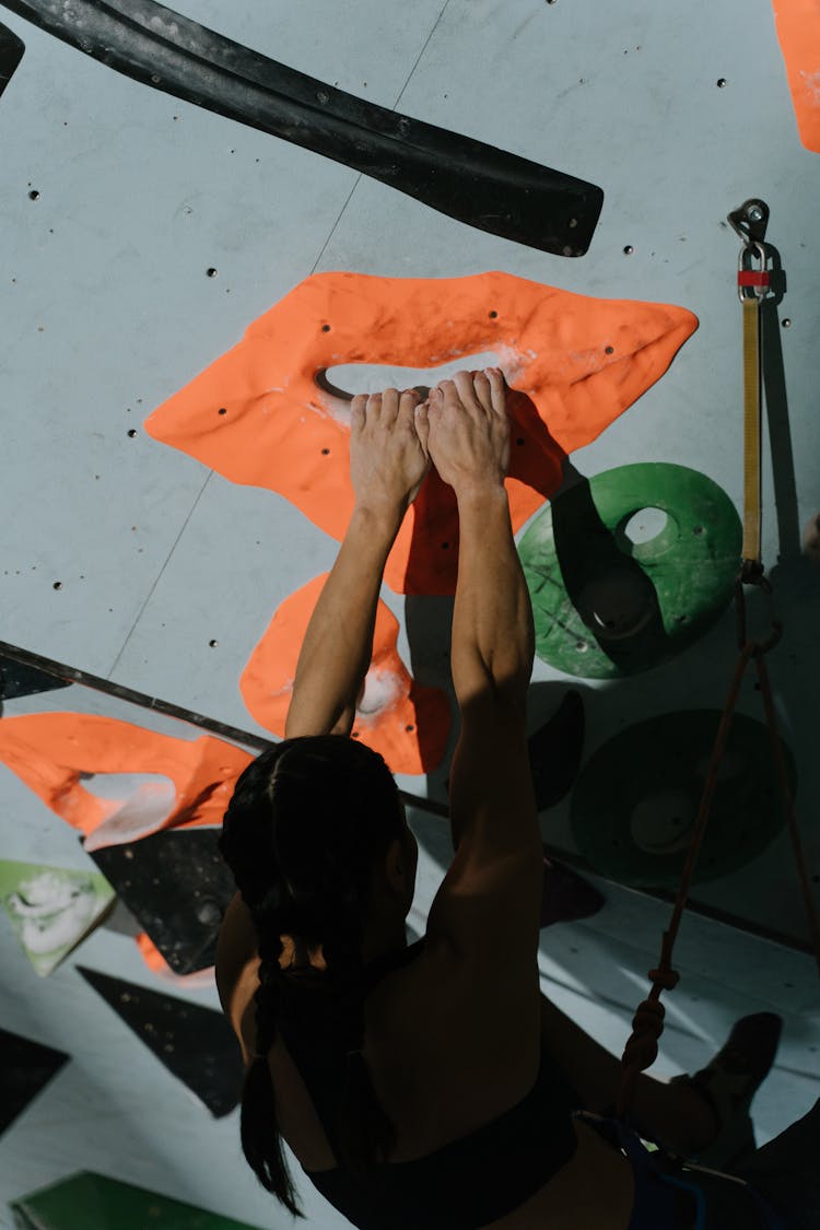 Woman Practising On Climbing Wall