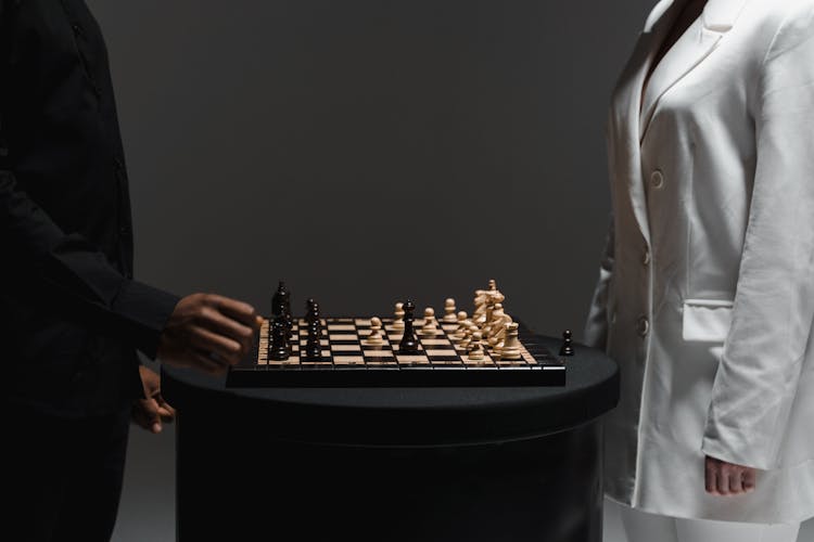 A Man And Woman Playing Chess