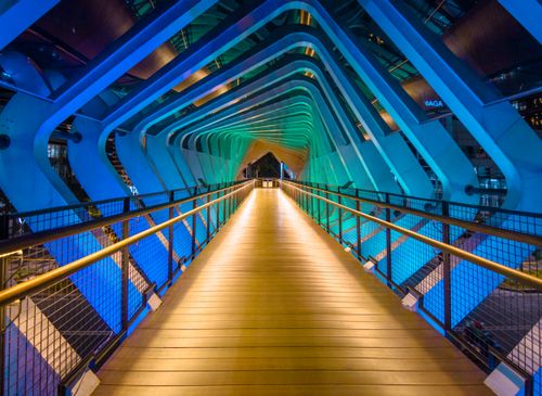 Free A stunning view of Jakarta's modern pedestrian bridge illuminated beautifully at night. Stock Photo
