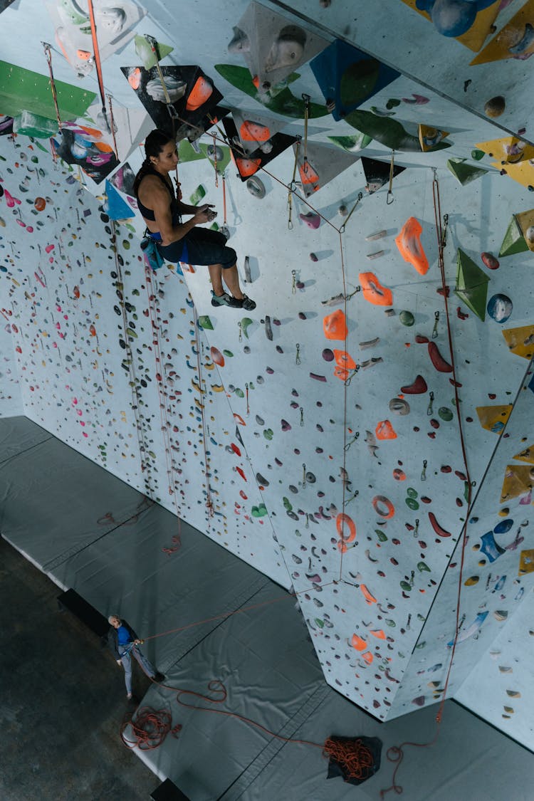 Climber Hanging On The Wall