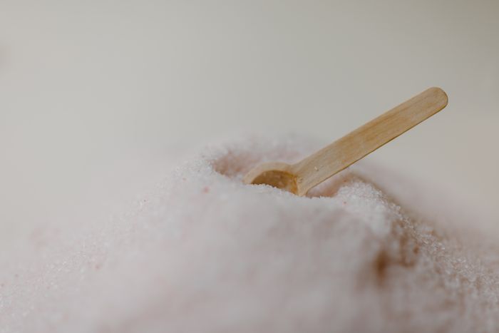 Pink mineral bath salt used for a natural body scrub treatment