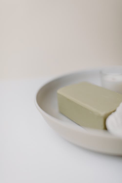 A Green Soap on a Ceramic Tray