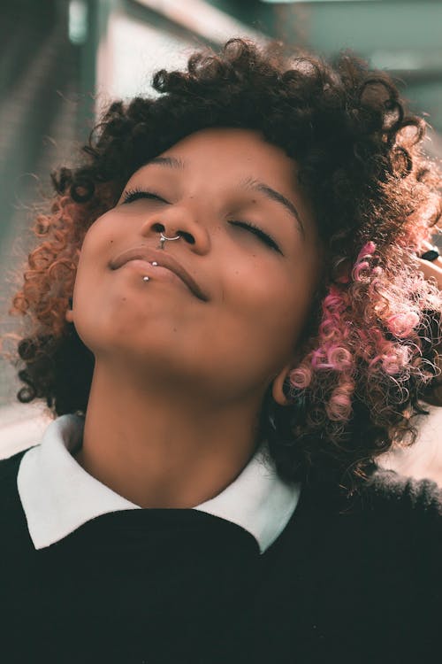 A Young Woman with a Nose Ring and Lip Piercing