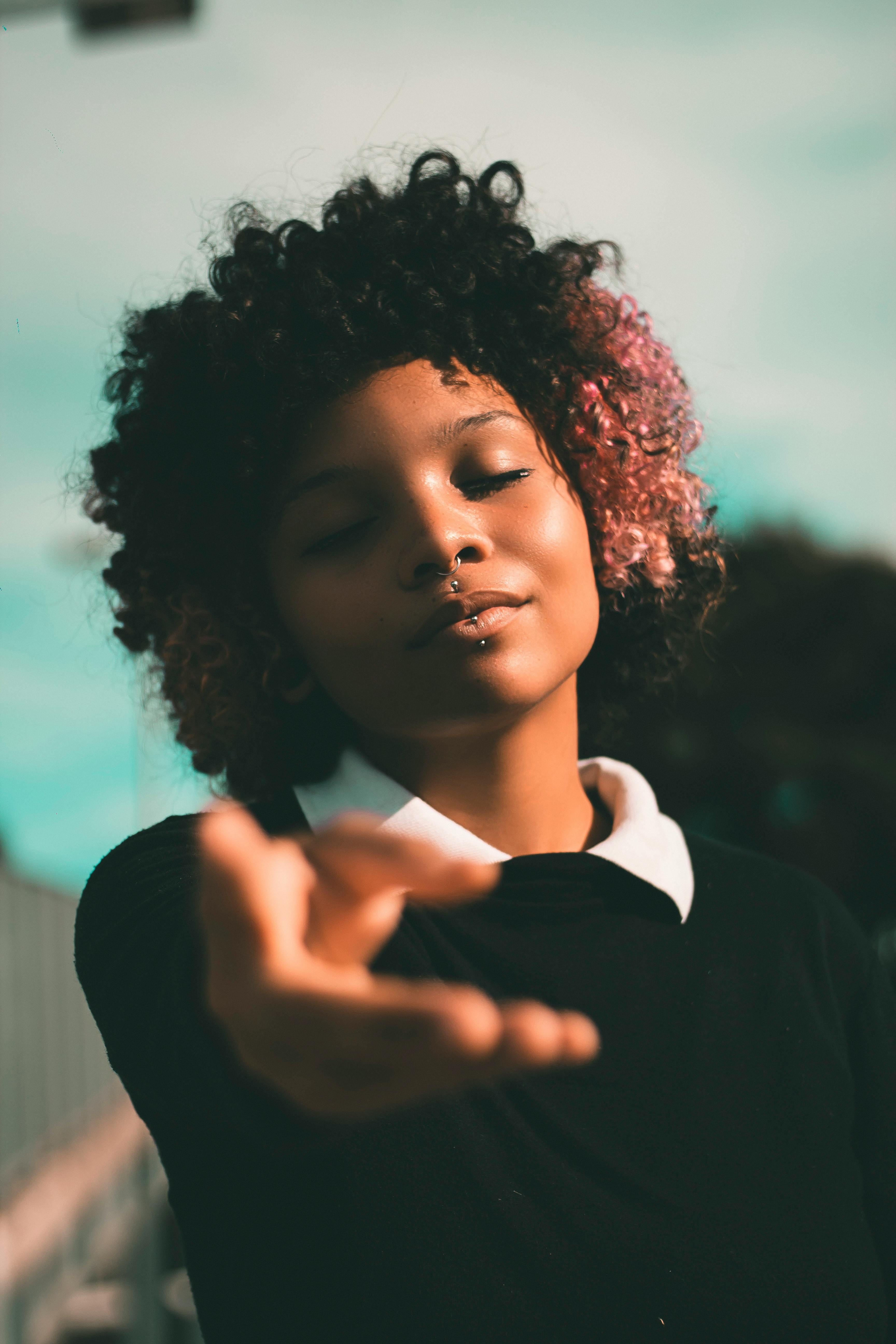 A Portrait of a Young Woman with Braided Hair · Free Stock Photo