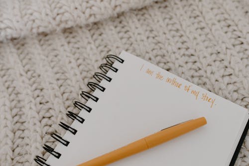 Close-up of a Notebook on a Knitted Surface