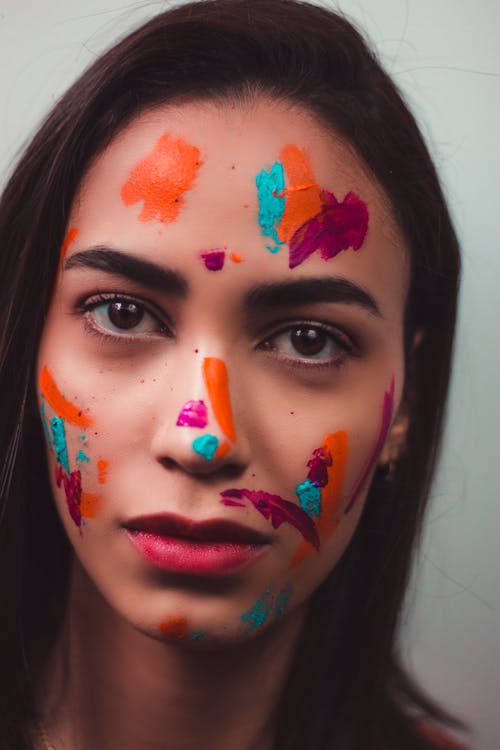 Woman with Face Painting Seriously Looking at the Camera