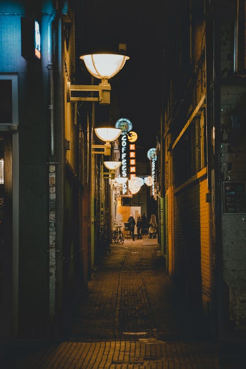 Free Landscape Photography of an Alley at Night Time Stock Photo