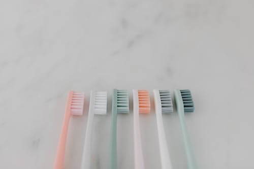 Toothbrushes on a Marble Surface