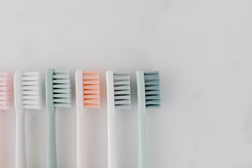 Top View of Toothbrushes on a Marble Surface