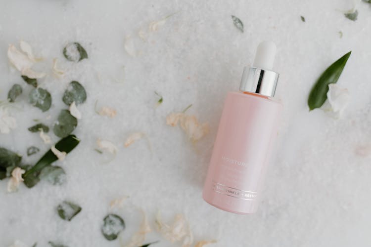 A Moisturizer In A Pink Dropper Bottle