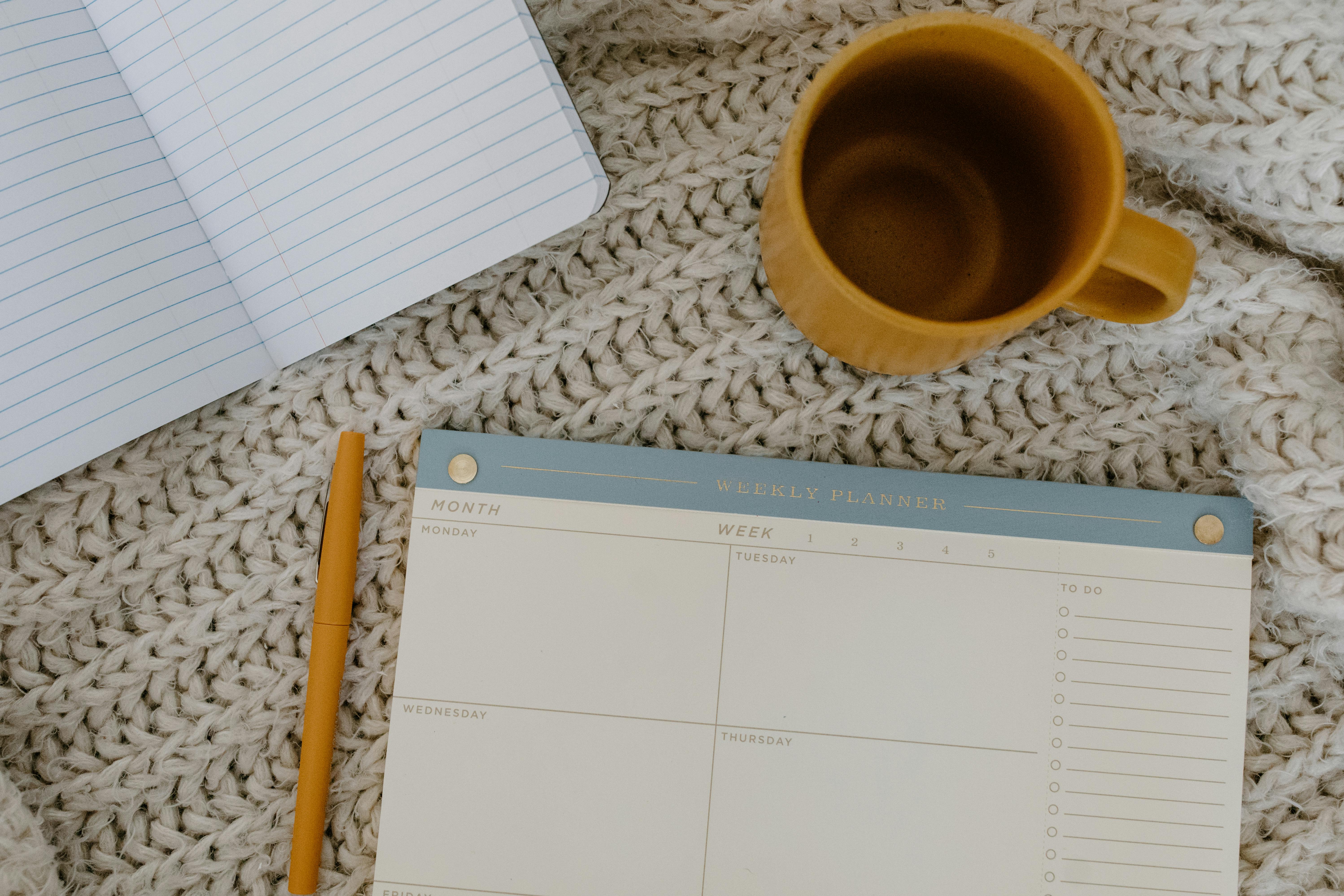 flatlay photo of weekly planner