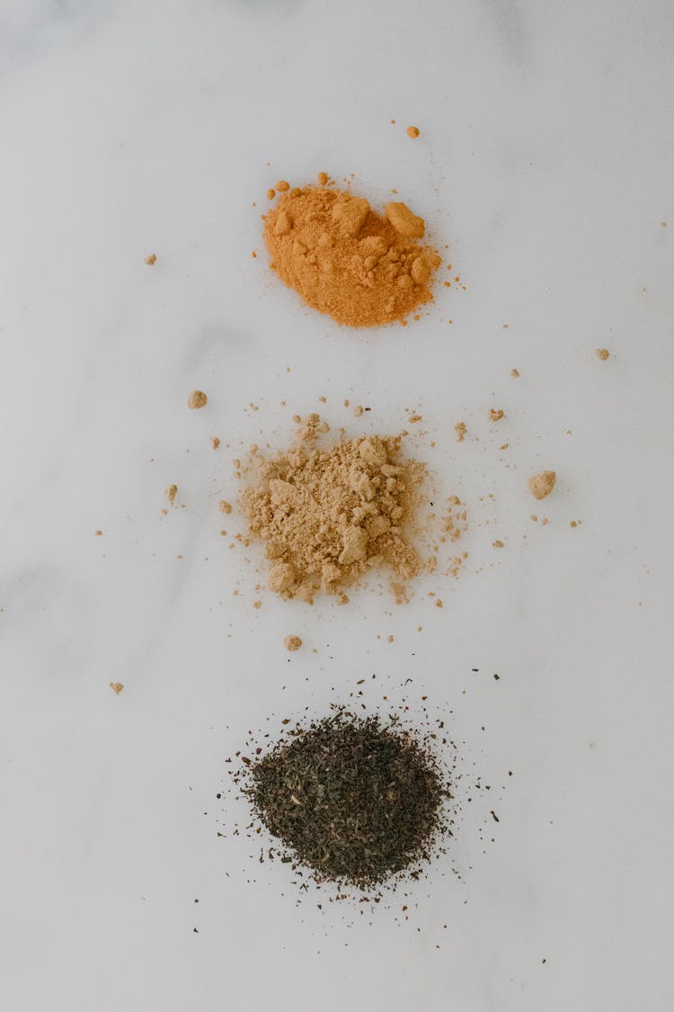 Powder Spices On A Marble Surface