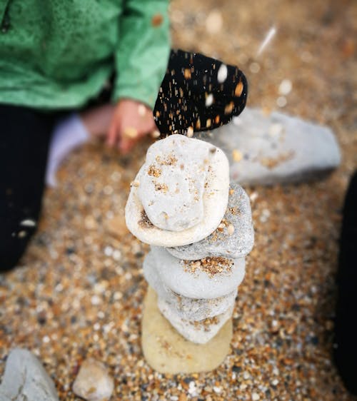 Free stock photo of pebble beach, pebbles, stone tower