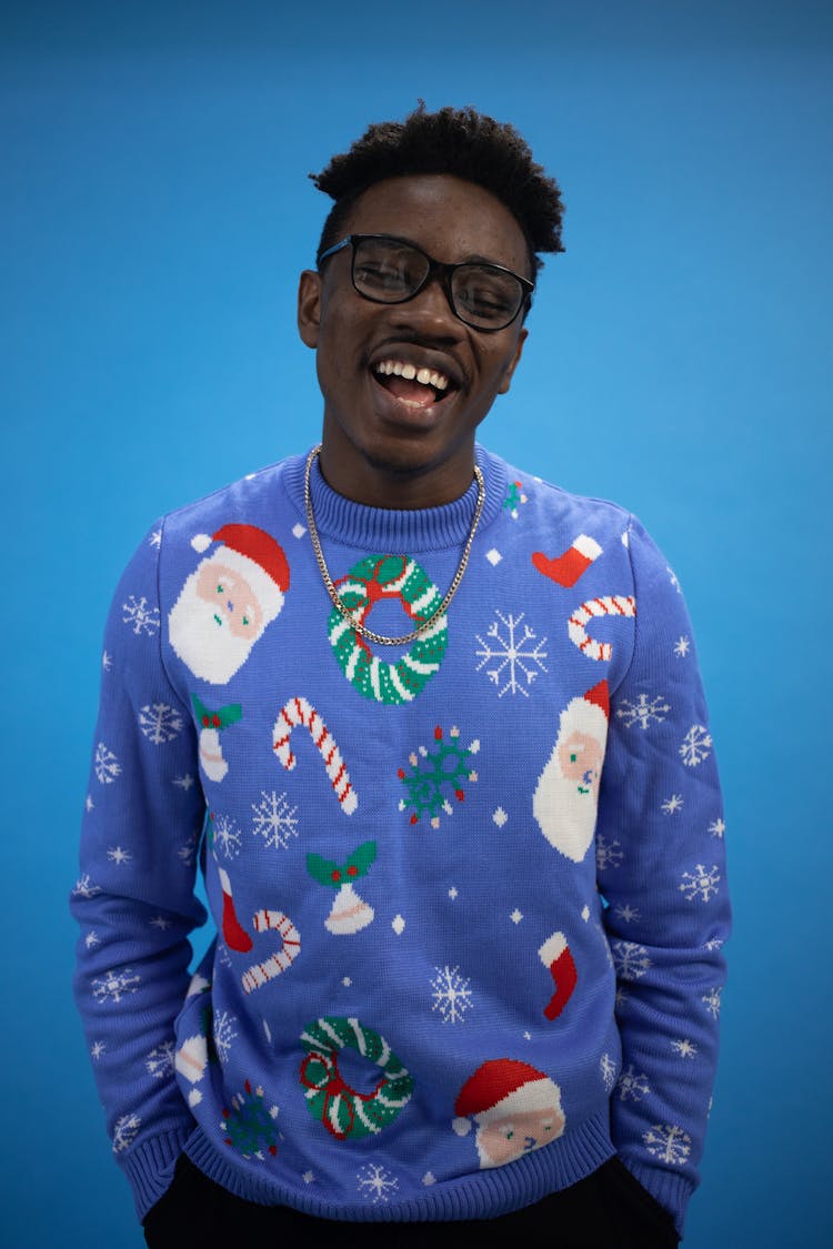 A Man In Blue Ugly Christmas Sweater Singing