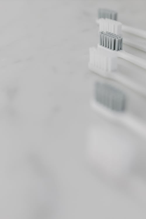 A White Toothbrush with Gray Bristles