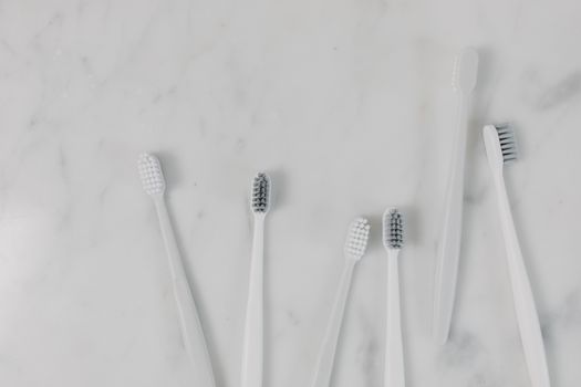 Top View of Toothbrushes on a Marble Surface