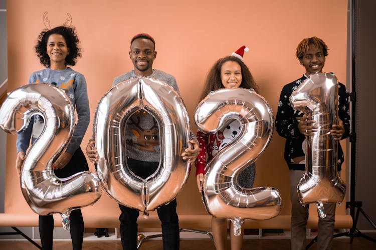 Happy People Holding 2021 Balloons 