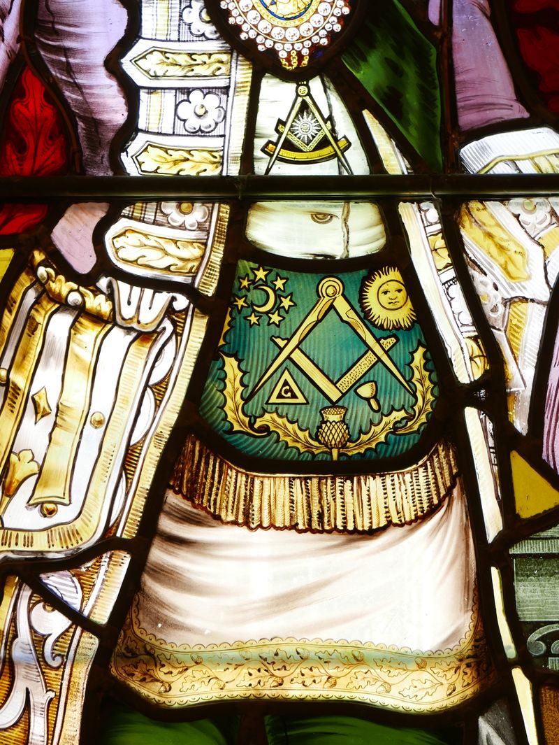 Masonic stained glass artwork featuring symbolic imagery