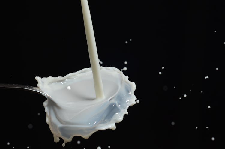 White Liquid On Stainless Steel Spoon