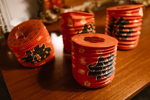 Free Brightly colored Chinese paper lanterns on a wooden surface, perfect for festive decorations. Stock Photo