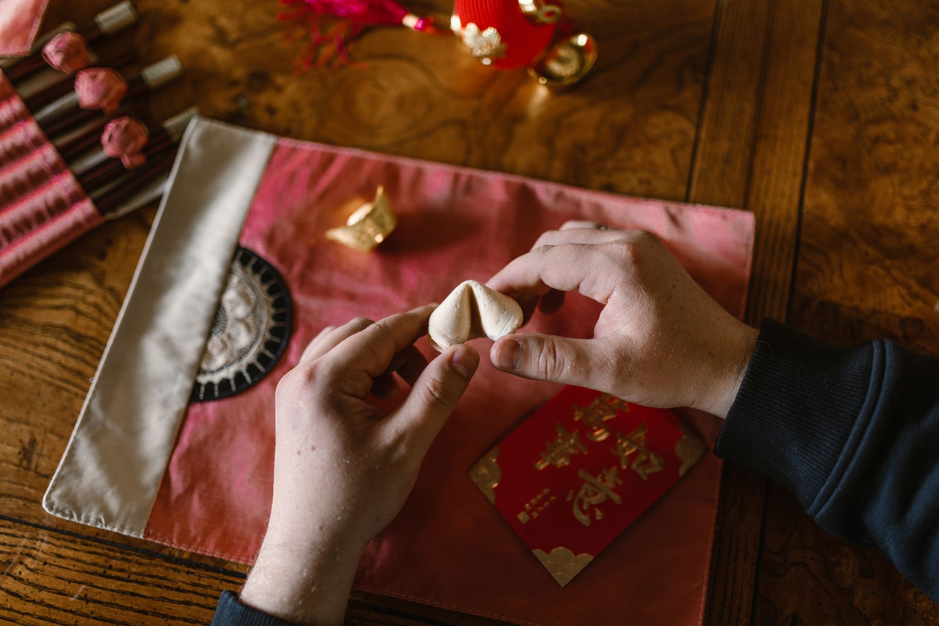 Person Holding A Fortune Cookie