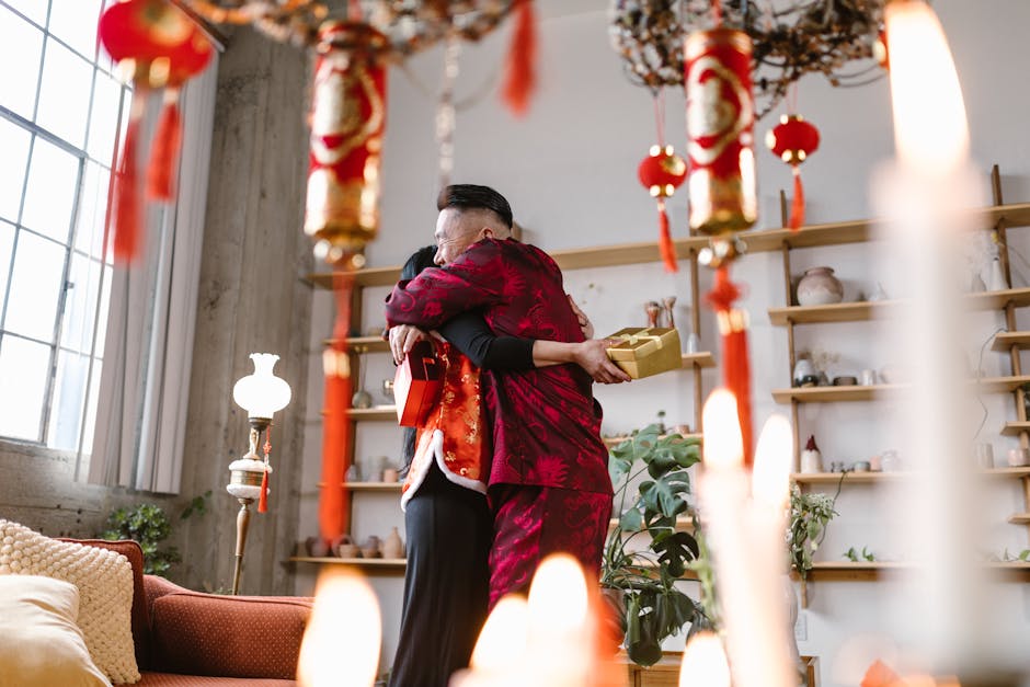 A heartwarming moment of two people embracing amidst Chinese New Year decorations indoors.