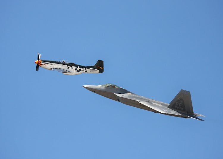 2 Jet Planes Flying Under Blue Sky