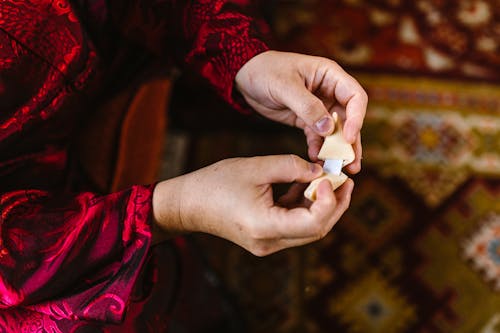  A Person Opening a Fortune Cookie