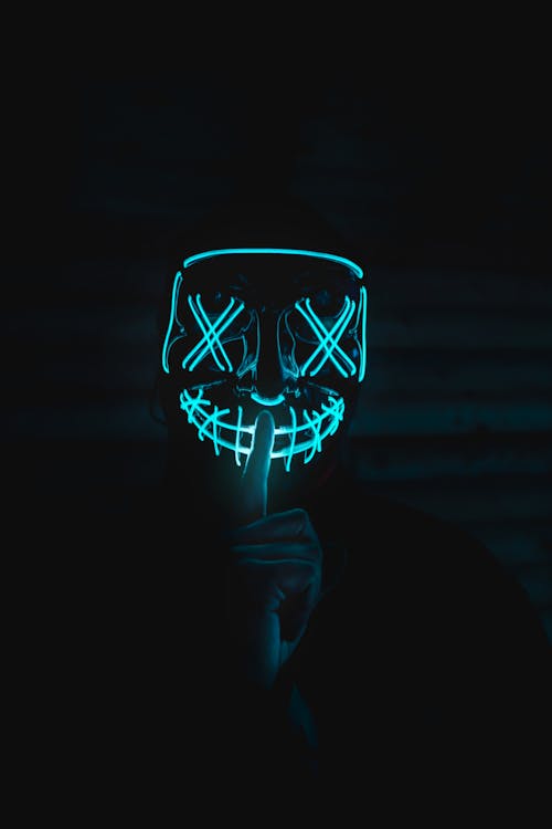 Free A Person in a Neon Mask Stock Photo