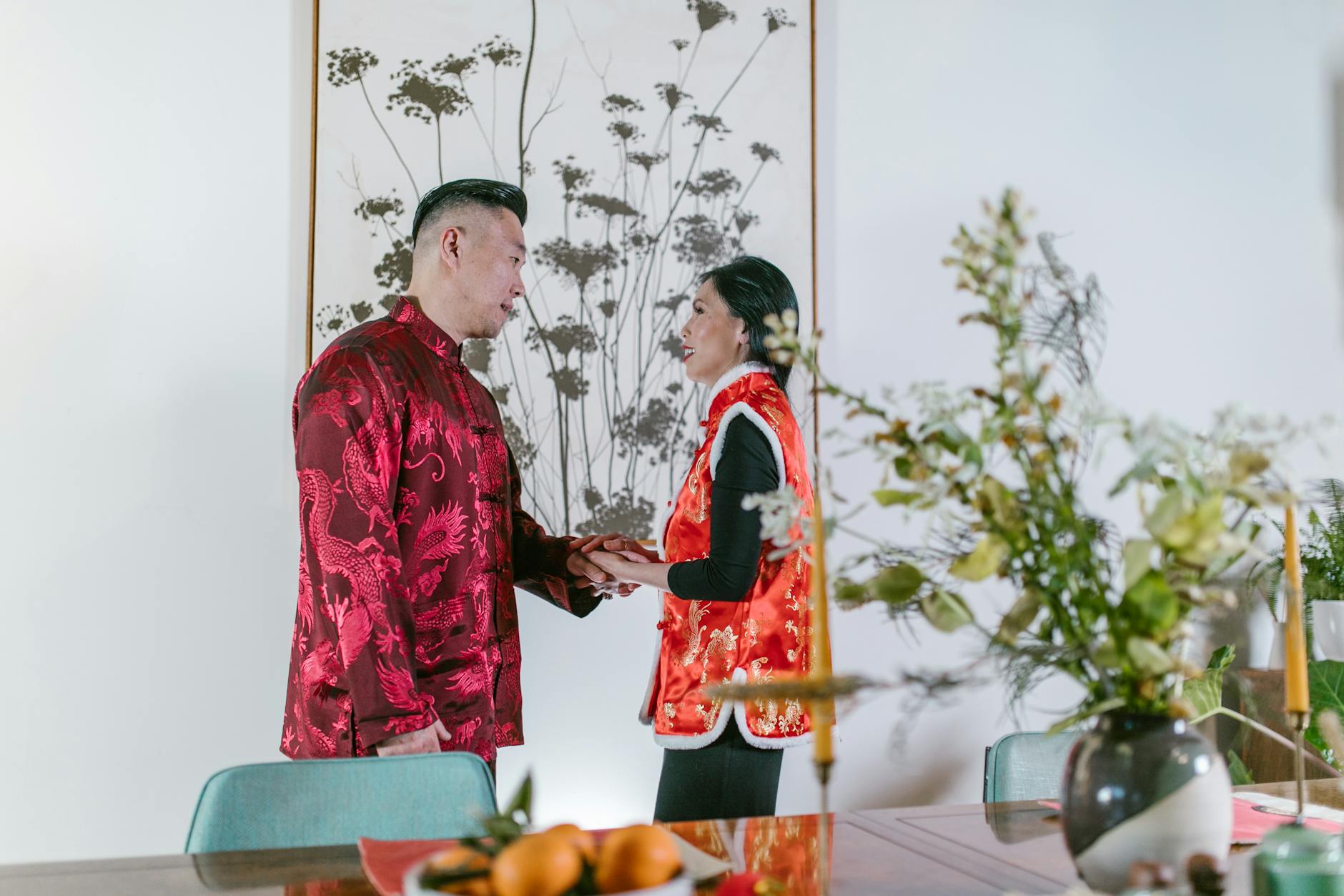 https://www.pexels.com/photo/a-couple-in-traditional-clothing-holding-hands-6691979/