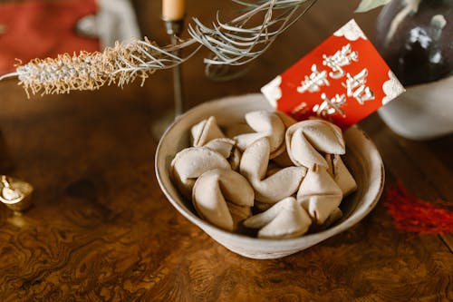 Cookies and Red Envelope in Ceramic Bowl 