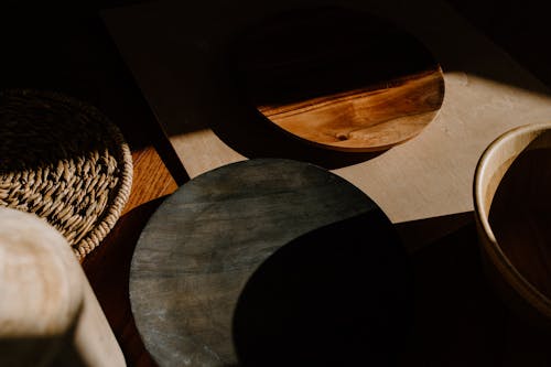 Black Round Plate on Brown Wooden Table