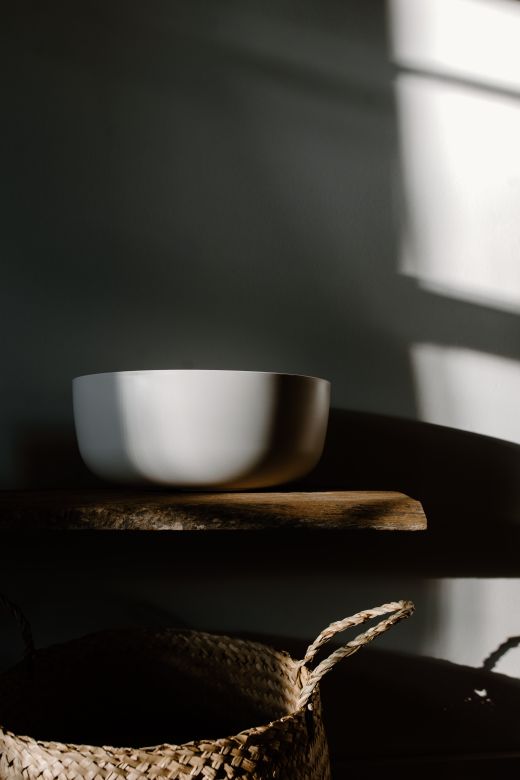 A white bowl on a wooden surface — Photo by Tara Winstead on Pexels