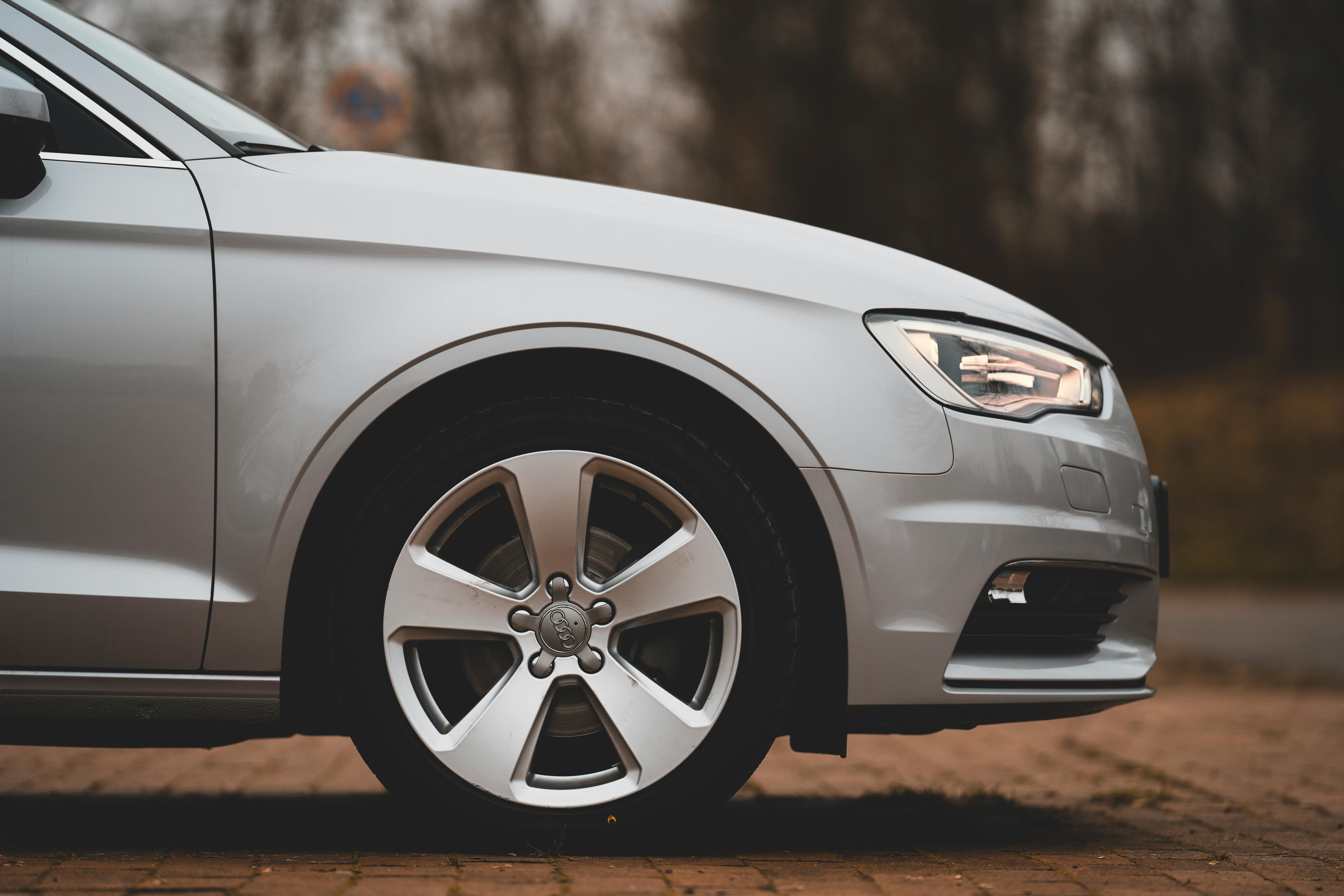 modern gray car parked on pavement