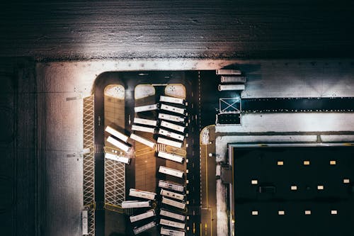 Aerial View of Buses Near a Concrete Building