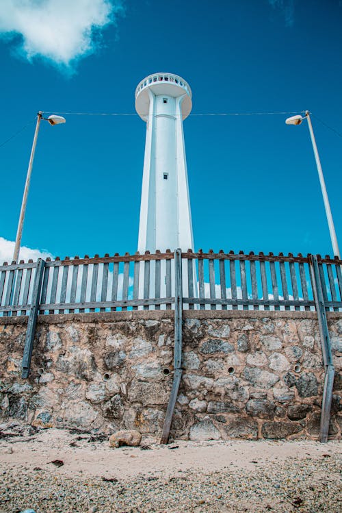 Free Lighthouse on City Beach Stock Photo