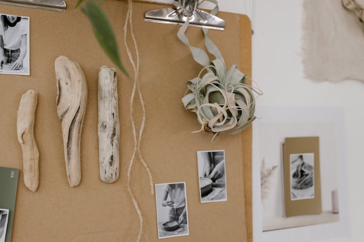 Corkboard With Artifacts On The White Concrete Wall