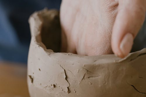 Free A Person Shaping a Clay Stock Photo