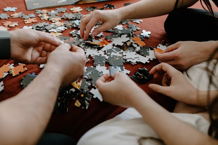 People Playing With Puzzles