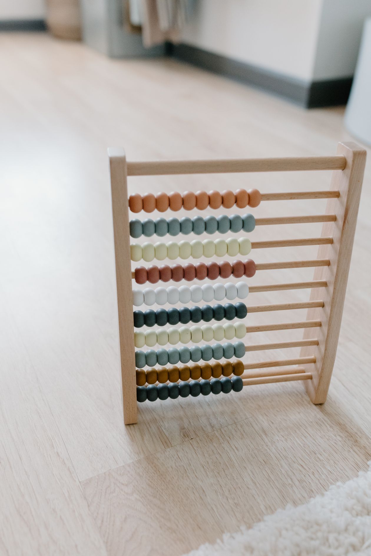 Colorful wooden abacus representing how to calculate the viral coefficient
