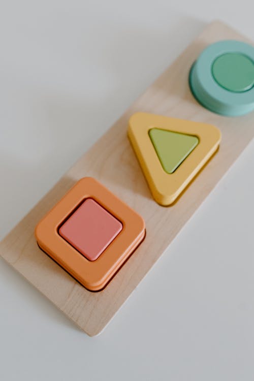 Colorful Wooden Toy on a White Surface