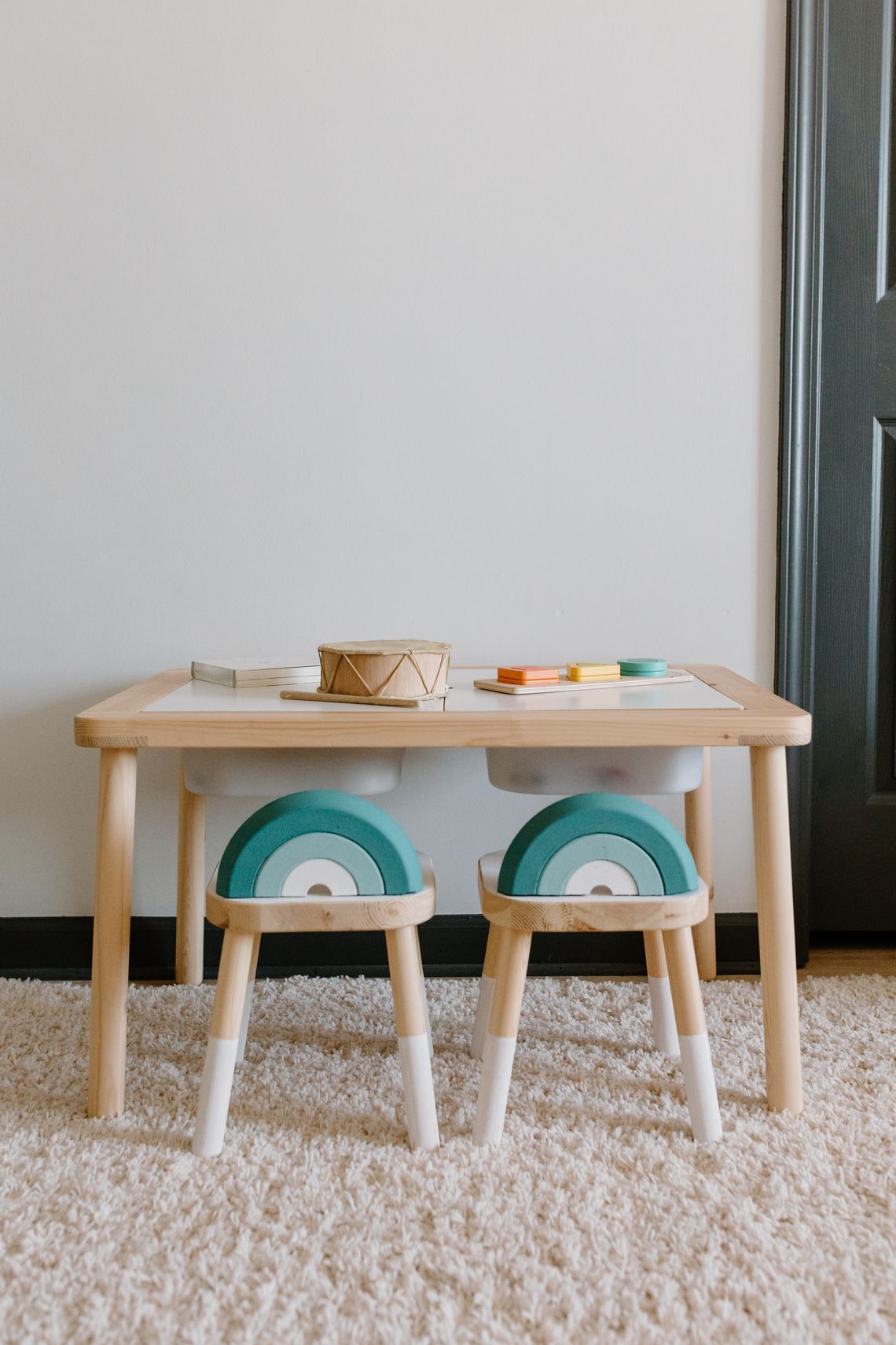 Calm child-friendly playroom with wooden furniture and educational toys