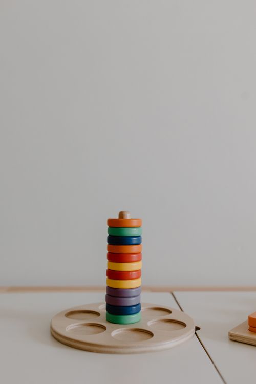 Free A colorful wooden stacking toy ready for imaginative play, enhancing children's motor skills. Stock Photo