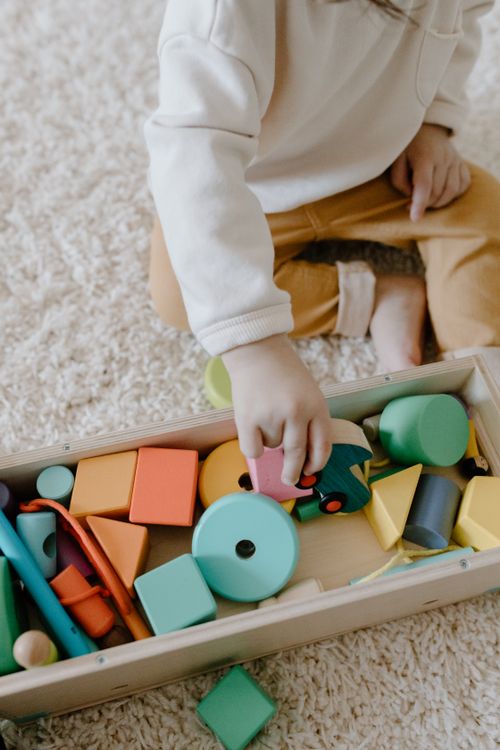 Colorful wooden building set in a box