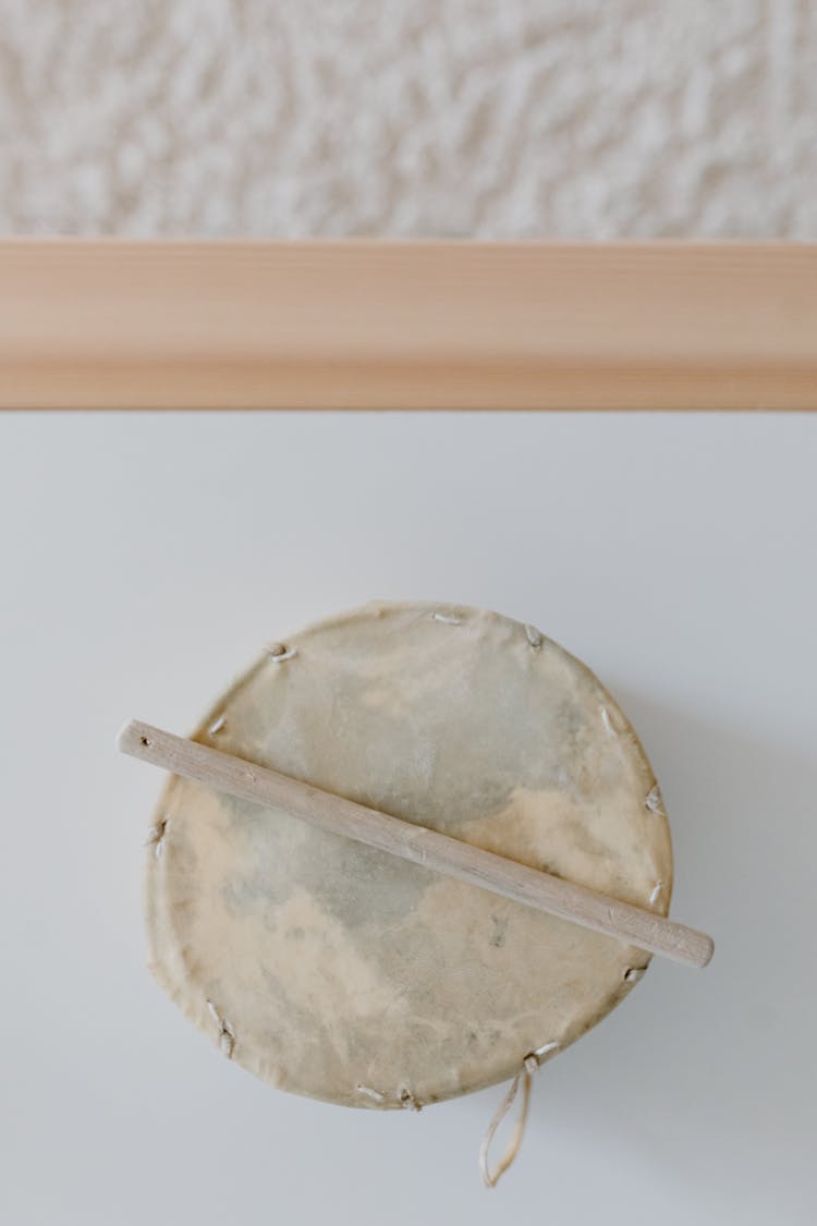 A Small Drum On White Surface