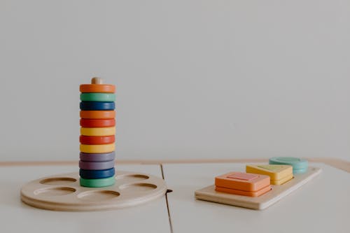 Colorful Wooden Educational Toys Near White Wall