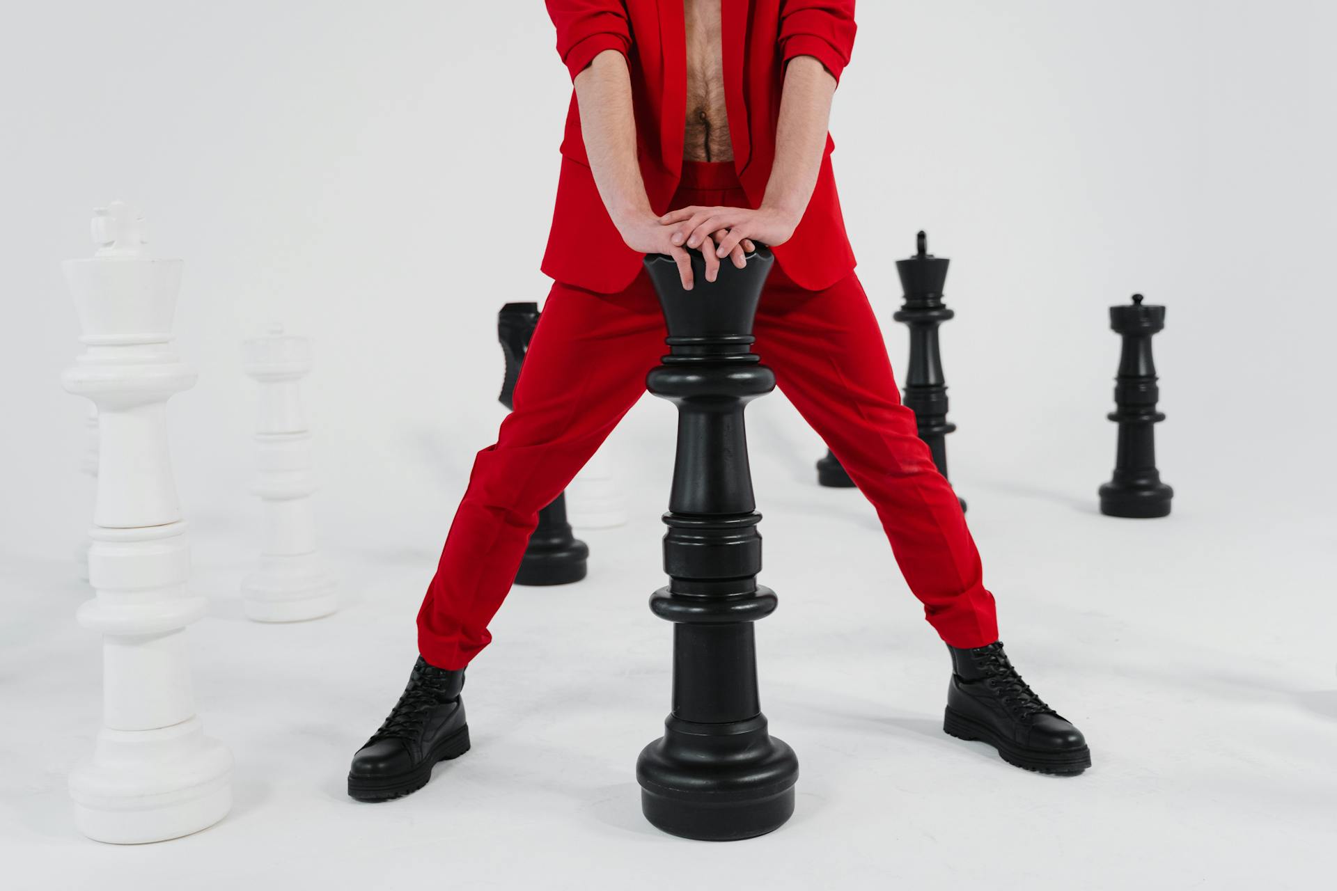 A Person Holding a Giant Chess Piece