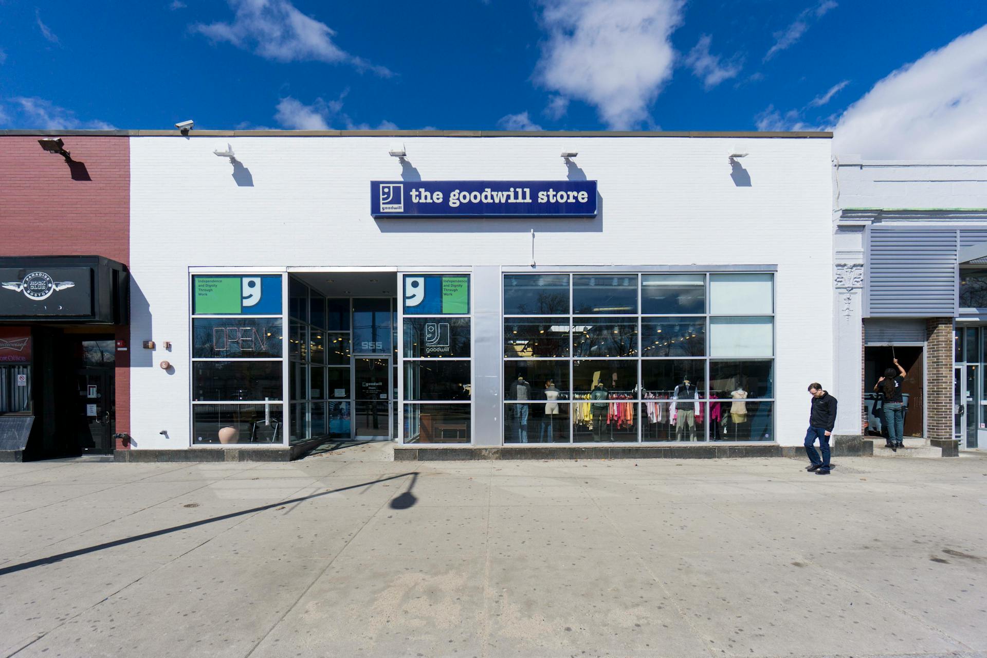 A Man Walking Near Goodwill Store