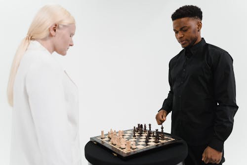 Woman and a Man Playing Chess